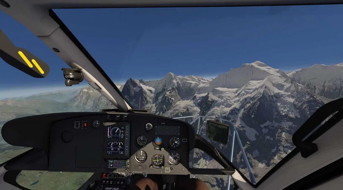 Official Loft Dynamics H125 simulator cockpit view over an alpine landscape.